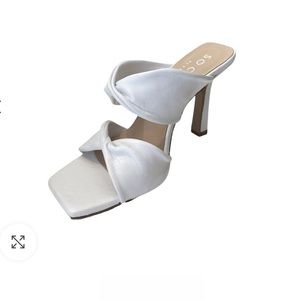 White knotted sandal heels